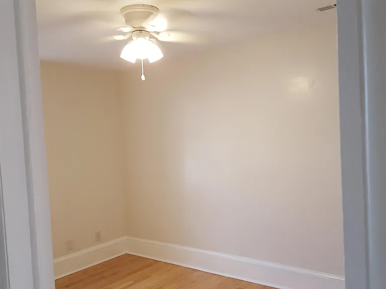Quiet bedroom in rear of the apartment with ceiling fan