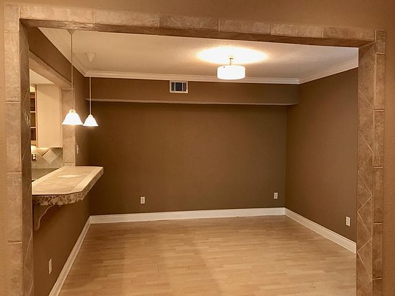 Open floorplan with kitchen opening up to dining room