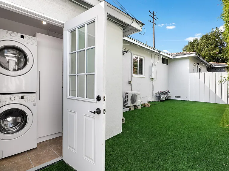 Private washer and dryer is in separate laundry room.