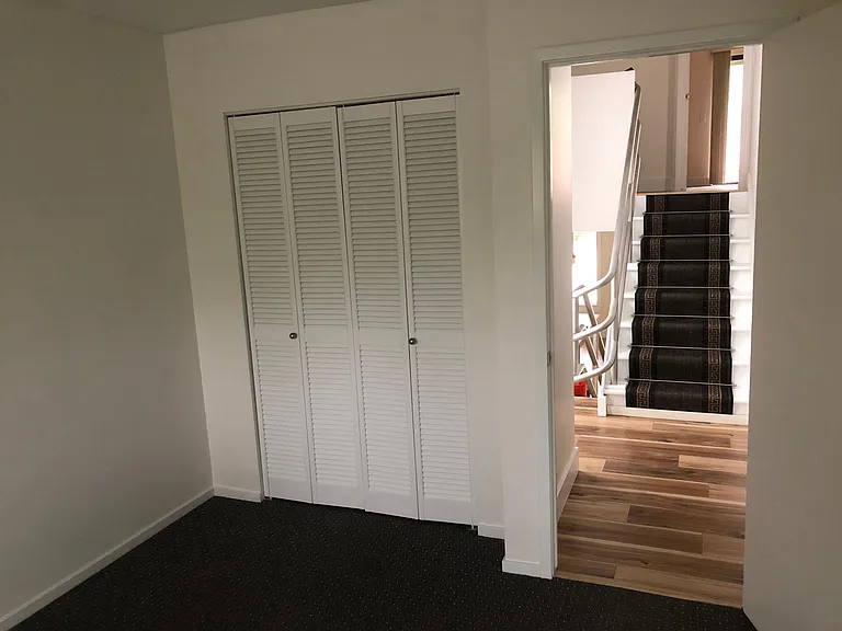 View from inside of one of the two identical bedrooms on the mid-level.