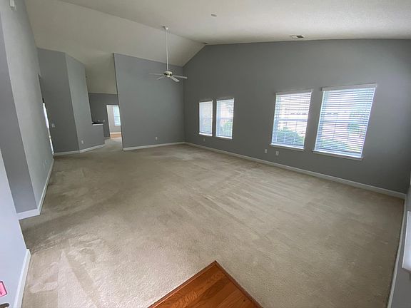 Entry way and living room with vaulted ceilings
