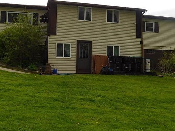 REAR OF HOUSE WITH WALK OUT LOWER LEVEL