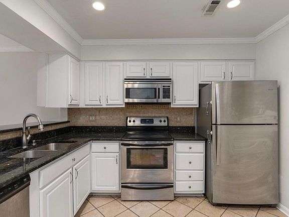 Kitchen with granite countertops and stainless appliances