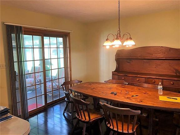Dining room with view of the enclosed sun porch.