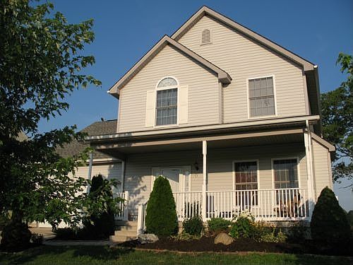 Two maple trees in front & a big porch