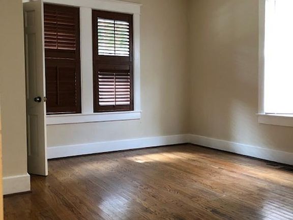 Front bedroom adjacent to living room with closet