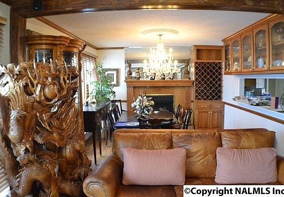 Hardwood flooring, fireplace, chandelier