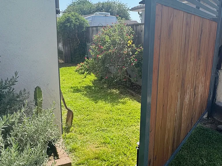 Secure side yard -- Perfect spot for a veggie garden