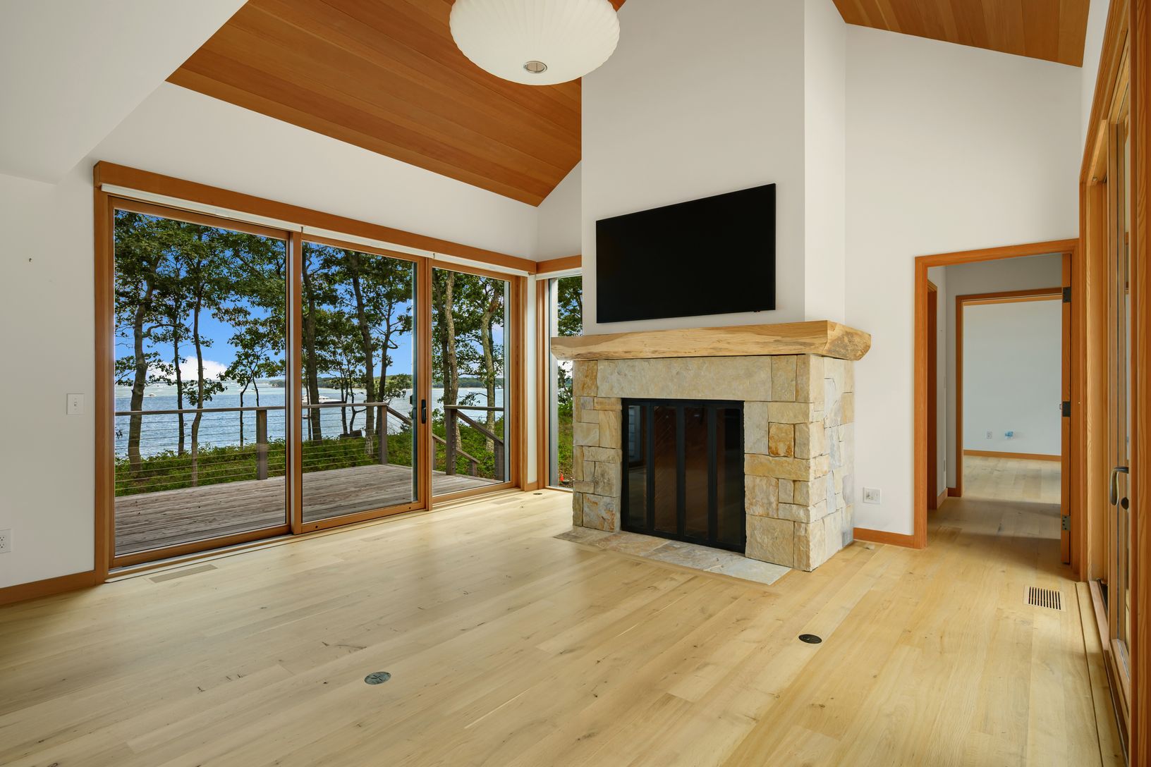  Custom made wood mantle with wood pegs. Great water views from most rooms.