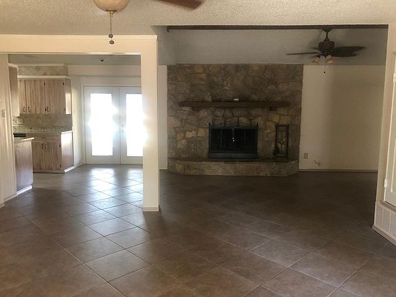 Large wood burning fireplace with blower unit.
