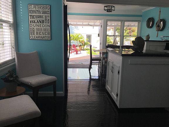 Kitchen sitting area into dining room and backyard