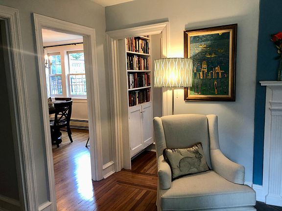 Living Room looking into Dining Room and Downstairs Bathroom