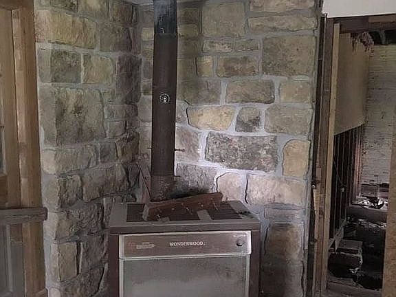 Solid rock behind woodstove