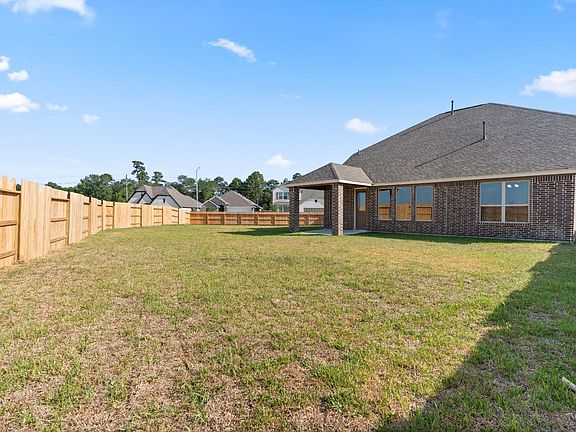 Come and see this spacious backyard with its beautiful covered patio. There is plenty of room for a