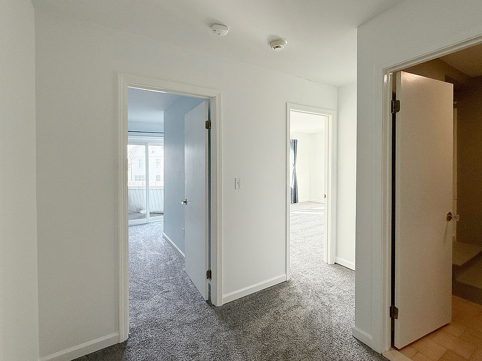 Hallway with doors to 2 bedrooms and 2nd full bathroom