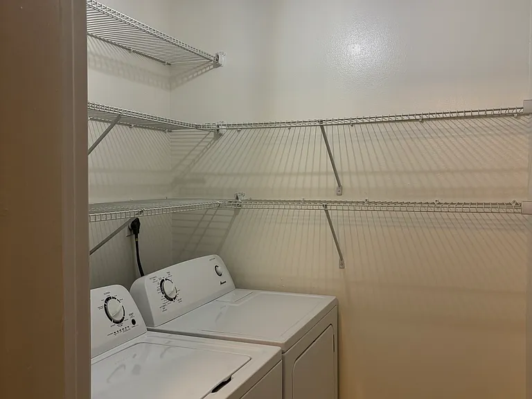 In-unit laundry room & pantry