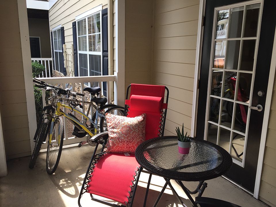 Outdoor seating with two reclining chairs and table.