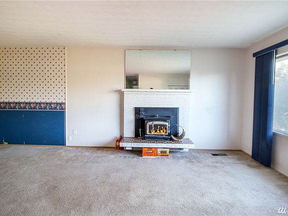 Living room with fireplace insert.