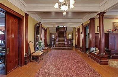 Large foyer, original fixtures, mahogany woodwork, oak flooring, pocket doors.