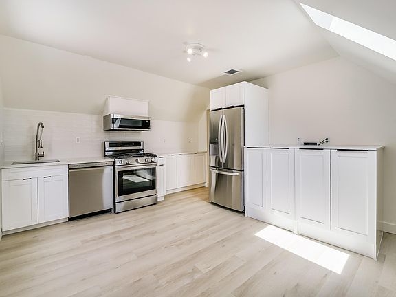 Fully renovated beautiful kitchen/dining with brand new french door fridge, dishwasher, gas stove/airfryer oven, microwave and laundry