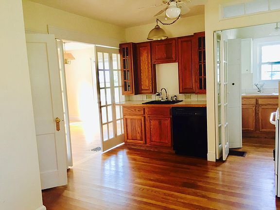 View from kitchen into dining room left and laundry room right.