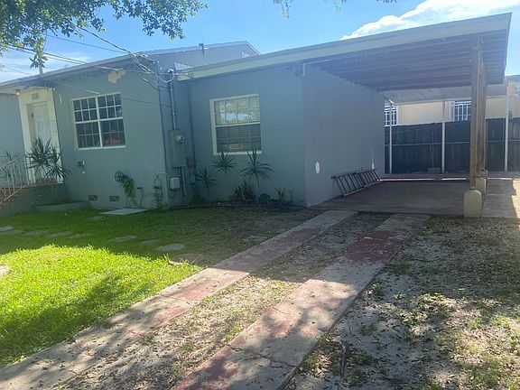 Covered carport and side terrace