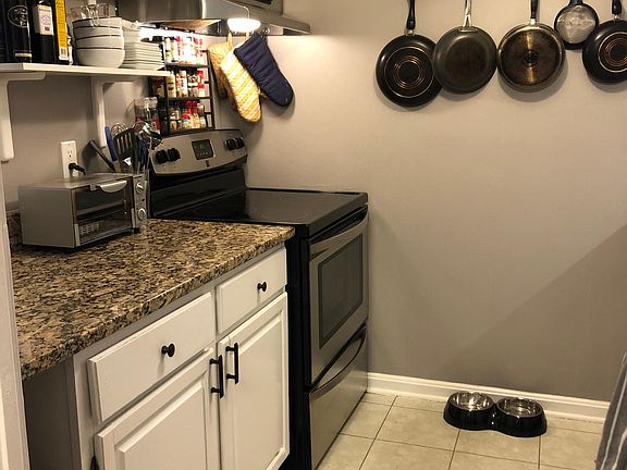 Open storage and granite countertops.