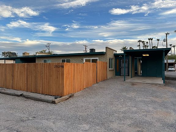 Front door - covered carport, storage unit, separate yard entrance