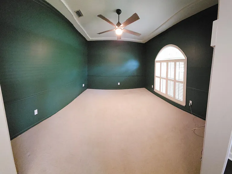Extra room 1, with upgraded wood shutters and remote ceiling fan.
