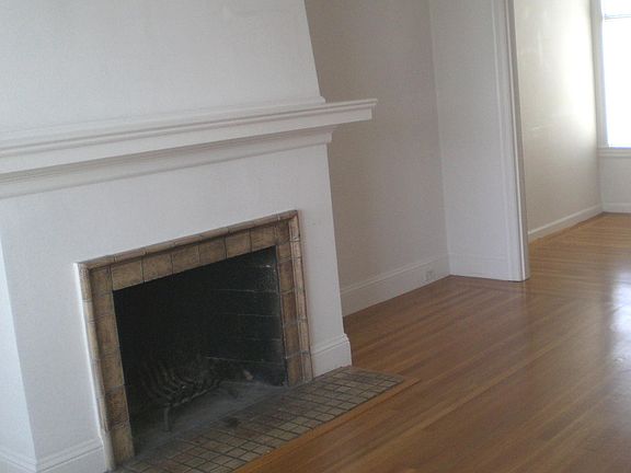 spacious light-filled living room (non functional fireplace)