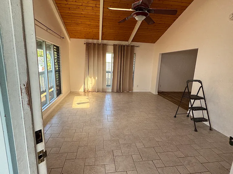 This area can be used as a 2nd living room, or an office. Great lighting with this skylight.