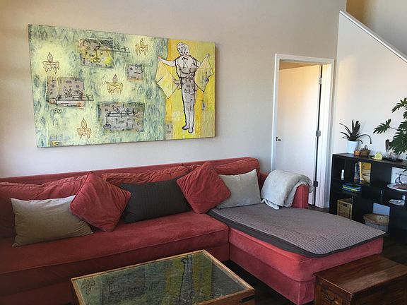 Spacious Living room Dark wood flooring thoughout