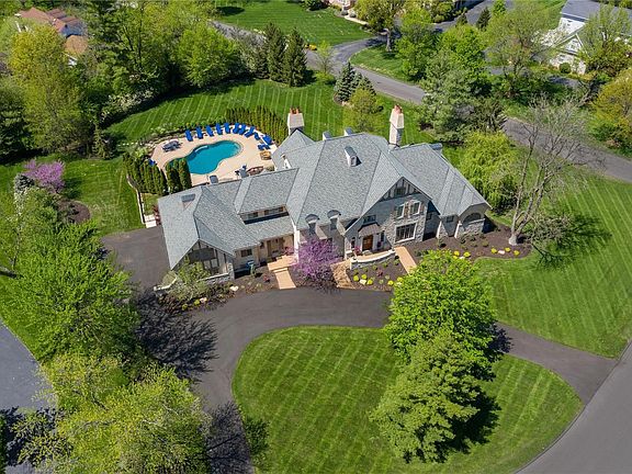 This lovely home features 6 bedrooms, 6 full and 3 half baths, 8466 sq.ft. of total living area, and a wonderful salt water pool.  This sits amidst an acre+ lot in an outstanding, convenient location.