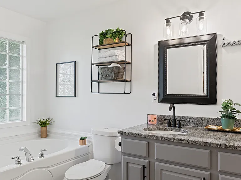 Glamorous primary bath with garden tub.