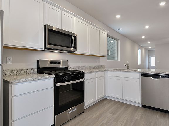 The kitchen appliances come included in this home.