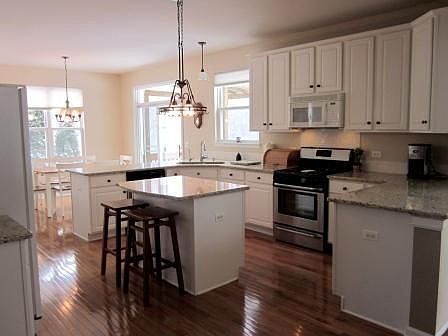 Large Kitchen with granite couters and hardwood floors