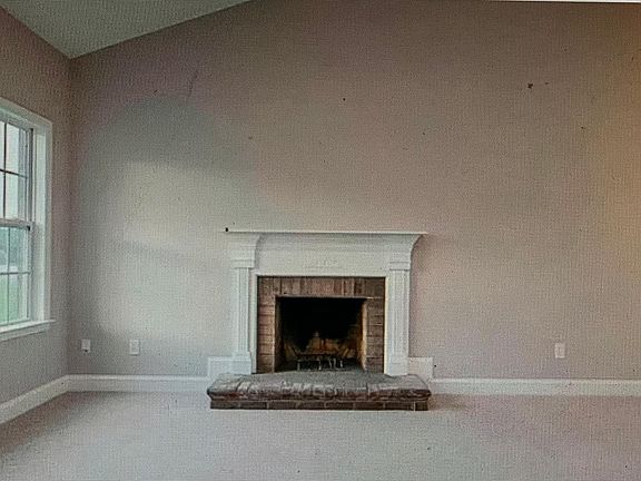 Living room with wood-burning fireplace