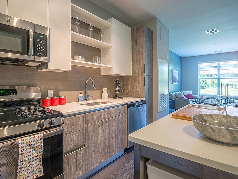 Stainless steel appliances and custom cabinets.