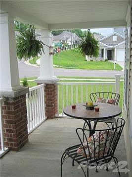 Covered porch with railing. Enhanced landscaping...just give it another week or two and you'll see p