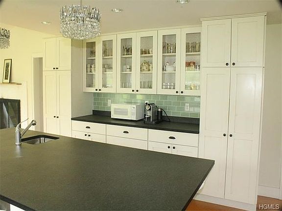 Abundant custom cabinetry for storage and preparation space.