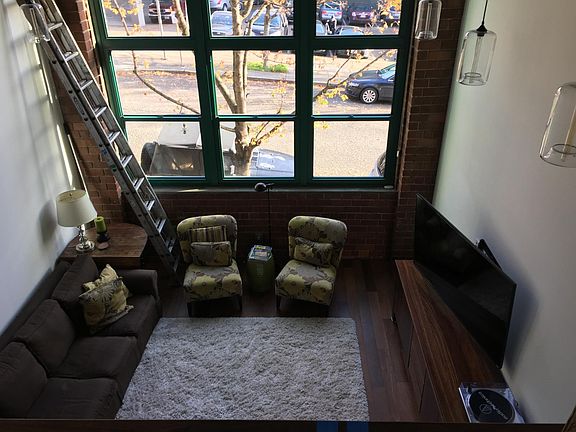 Living room with 18-ft ceiling and tall windows
