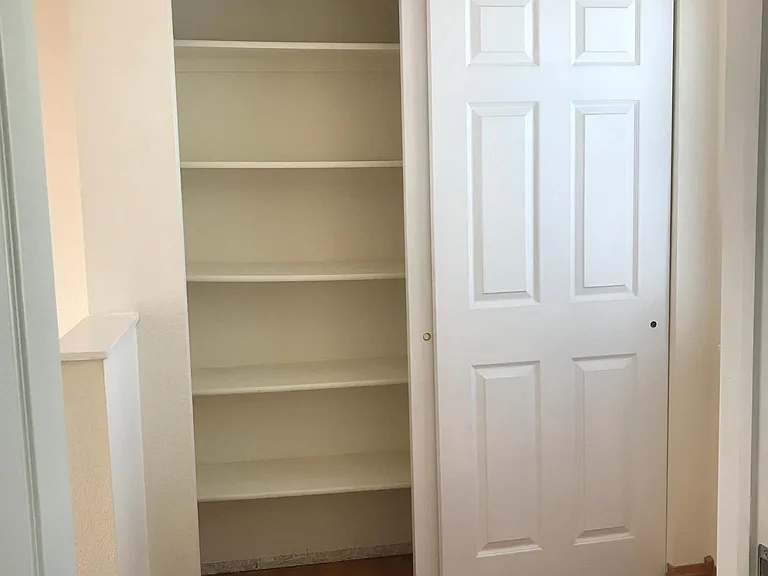Upper floor linen closet with room for desk/office area