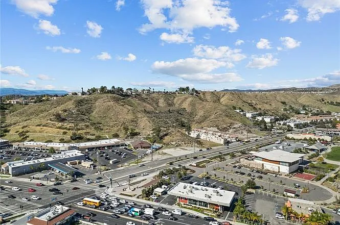 Aerial view of proximity restaurants, shops, and a park