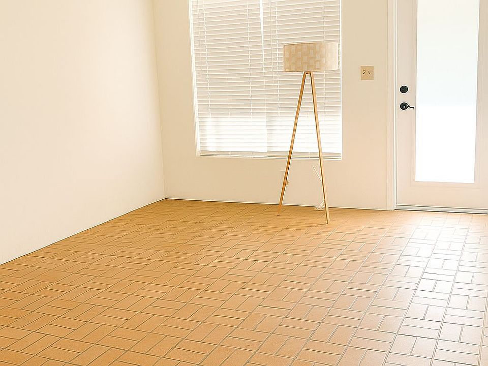 Main entrance to the unit
Very big living room with rustic floors
Impact doors
New fan
Tons of natural light