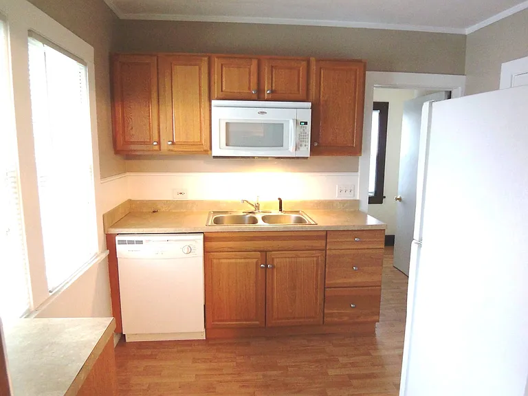 Super cute kitchen includes dishwasher and built-in microwave, to free up counter space.
