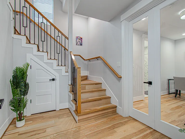 Welcoming entryway with plenty of space for arriving guests, creating an inviting first impression and easy access to the home's living areas.