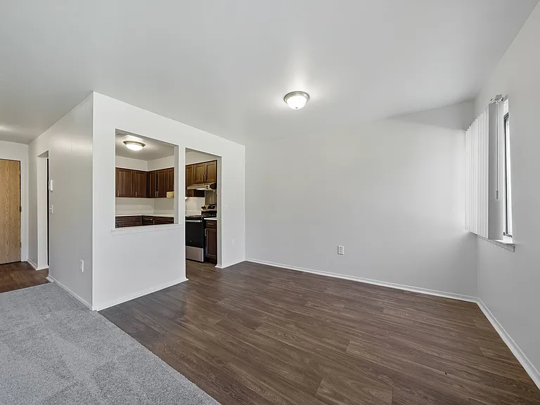 Open Living/Dining Room with natural light at Franklin River Apartments in Southfield, MIng Room with natural light at Franklin River Apartments in Southfield, MI
