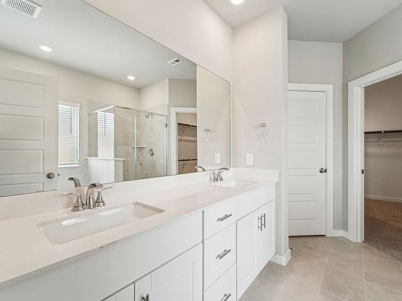 The Reynolds floorplan in Heights of Barbers Hill of Mont Belvieu, TX.