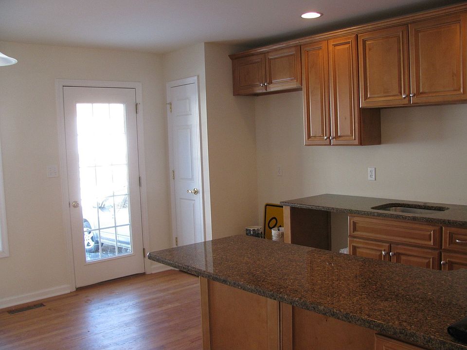 granite counters and hardwood floor