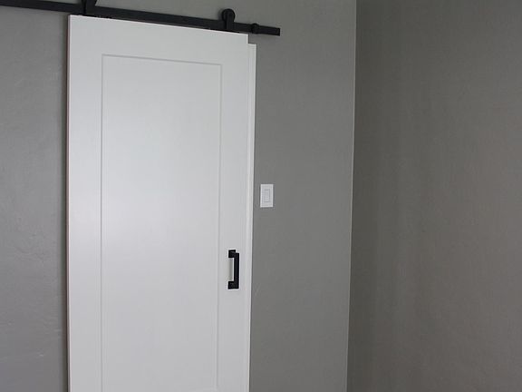 Barn door to bathroom
